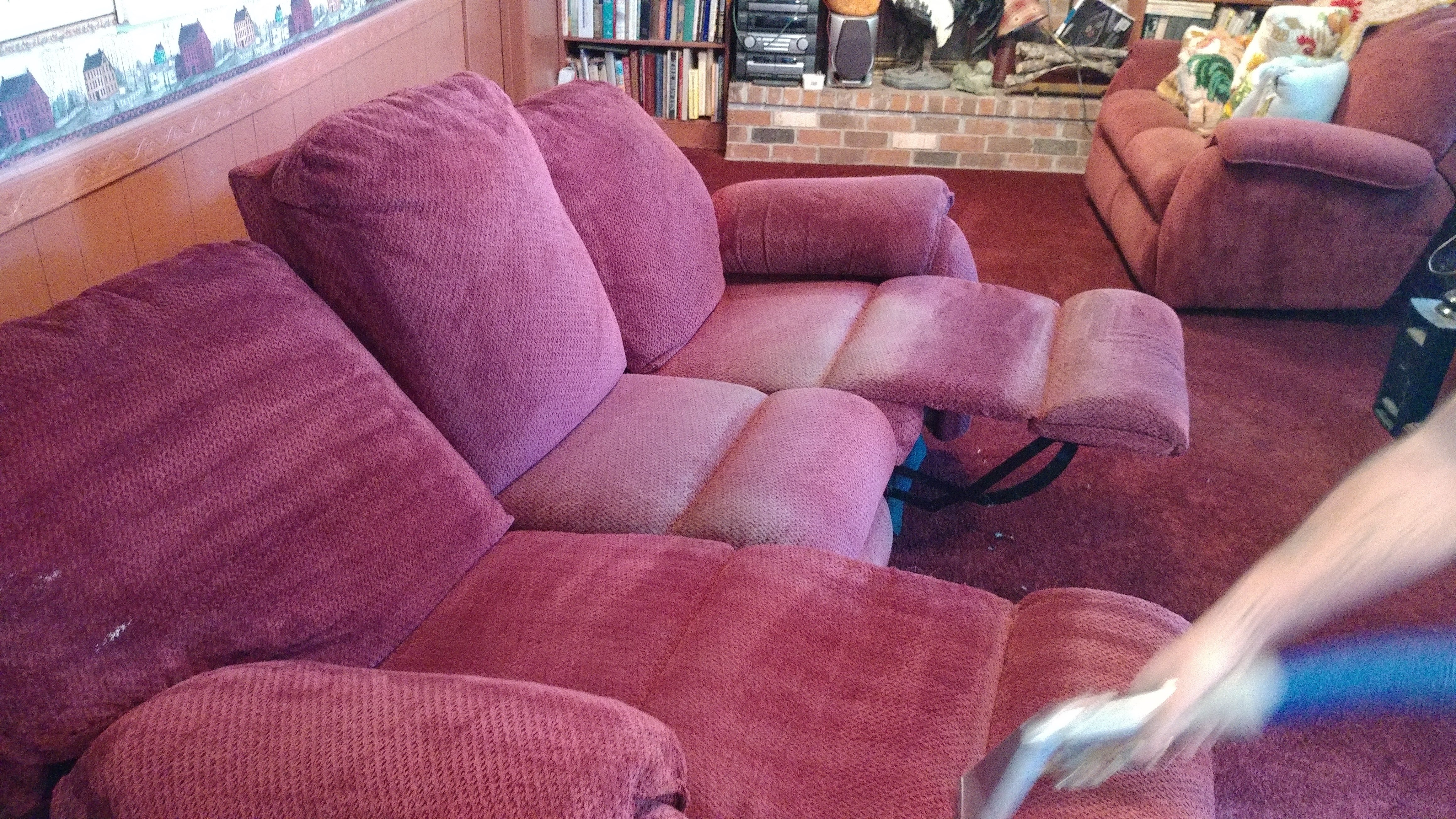 Reclining sofa being cleaned
